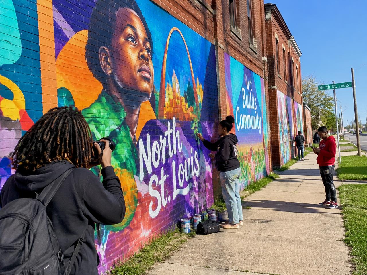 Young creatives at a North St. Louis mural